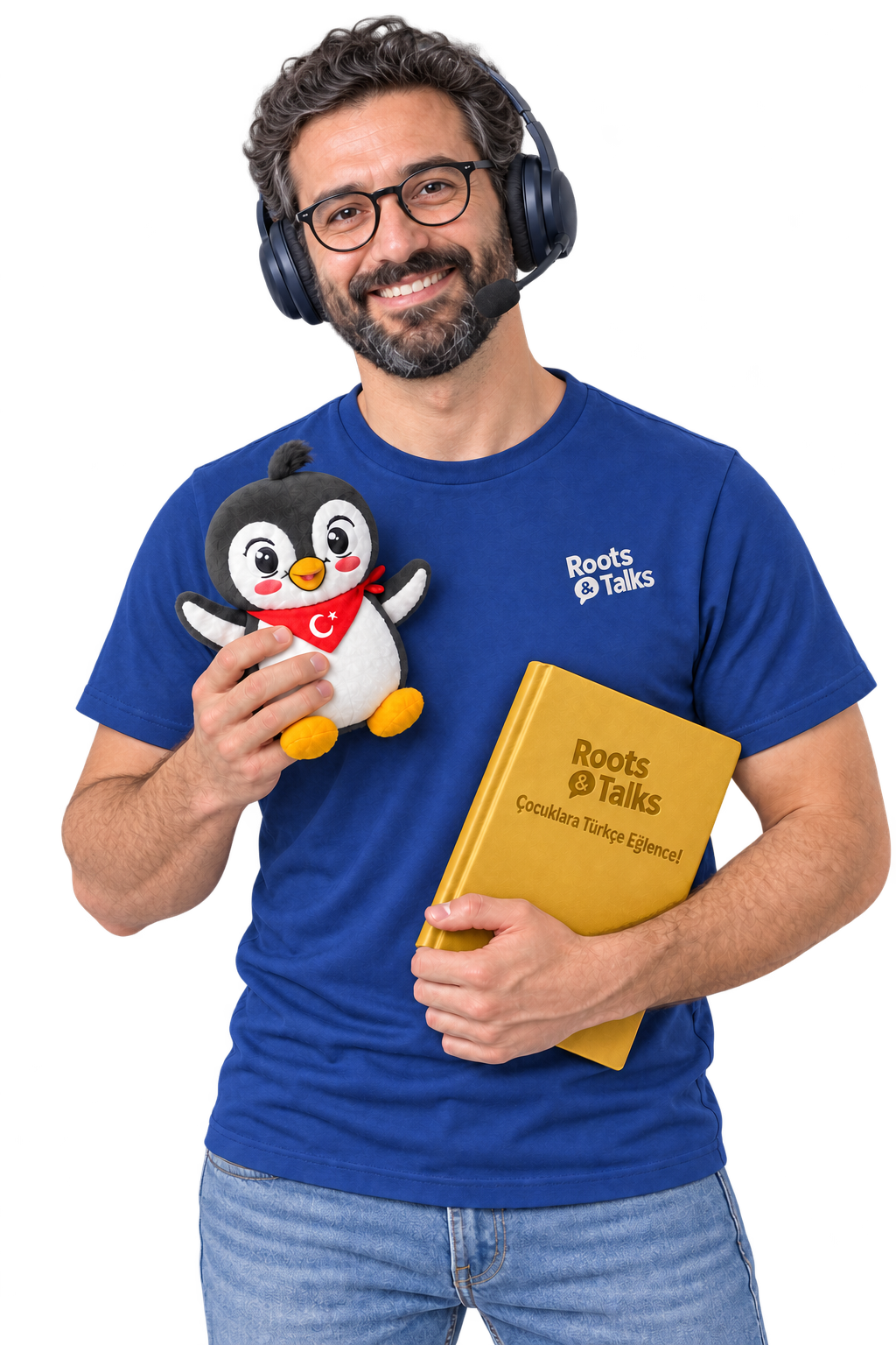 An online teacher in a blue Roots & Talks T-shirt holding the Pingucan plush toy and a gold-coloured Turkish book