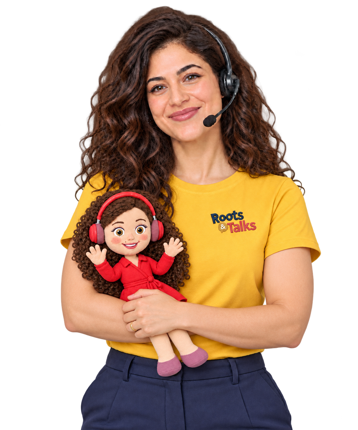 A Turkish teacher with folded arms holding up the Dünya doll and smiling with closed lips